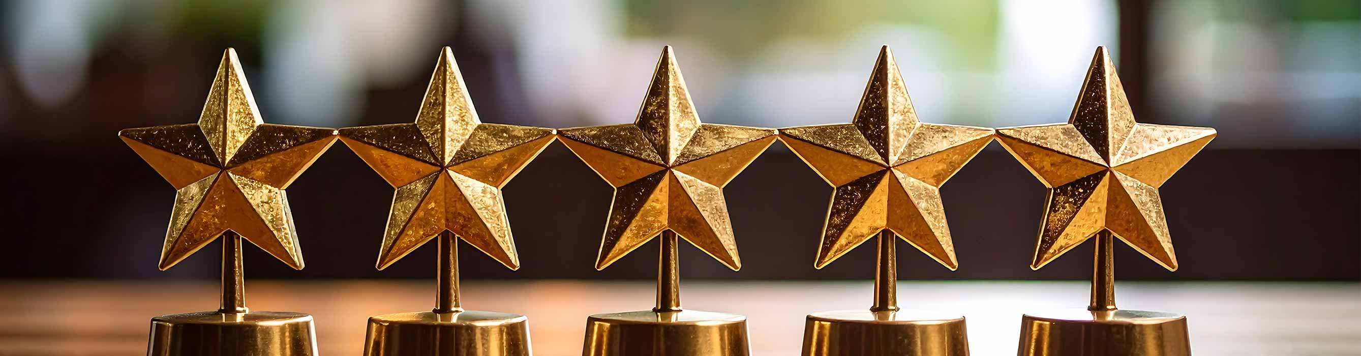 five golden stars on a wood table